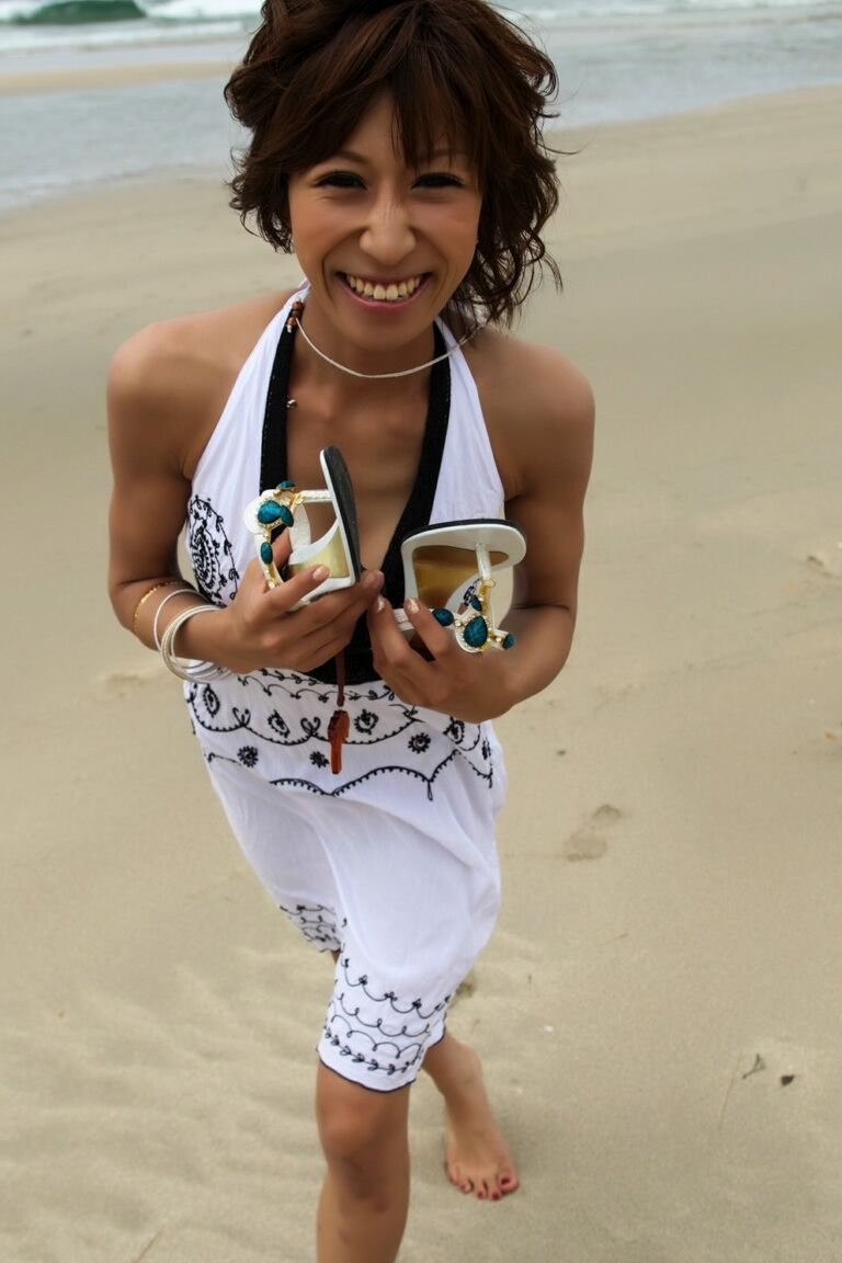 12P Japanese girl wears a bikini while playing in the ocean during a beach holiday