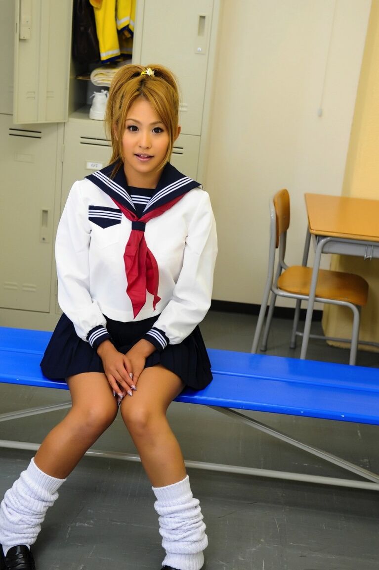 12P Adorable Japanese student with a pretty face poses on a bench in her uniform