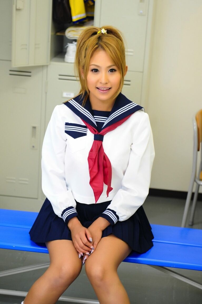 12P Adorable Japanese student with a pretty face poses on a bench in her uniform