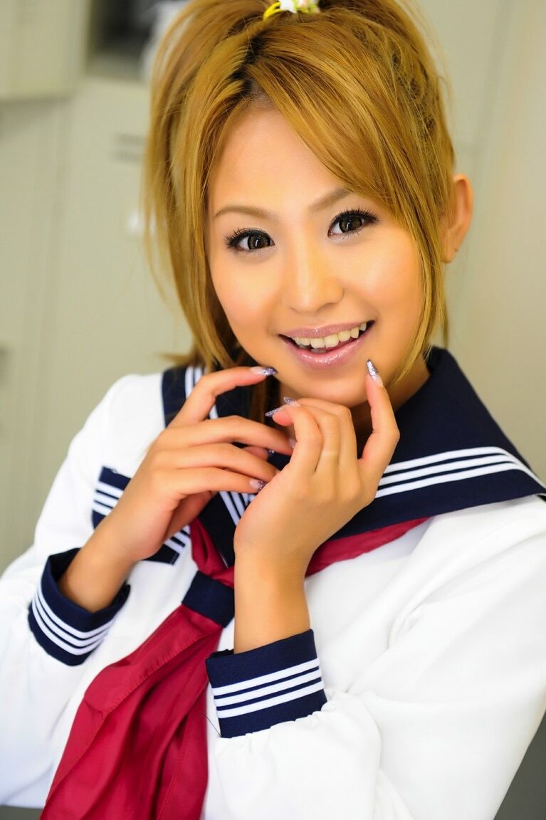 12P Adorable Japanese student with a pretty face poses on a bench in her uniform