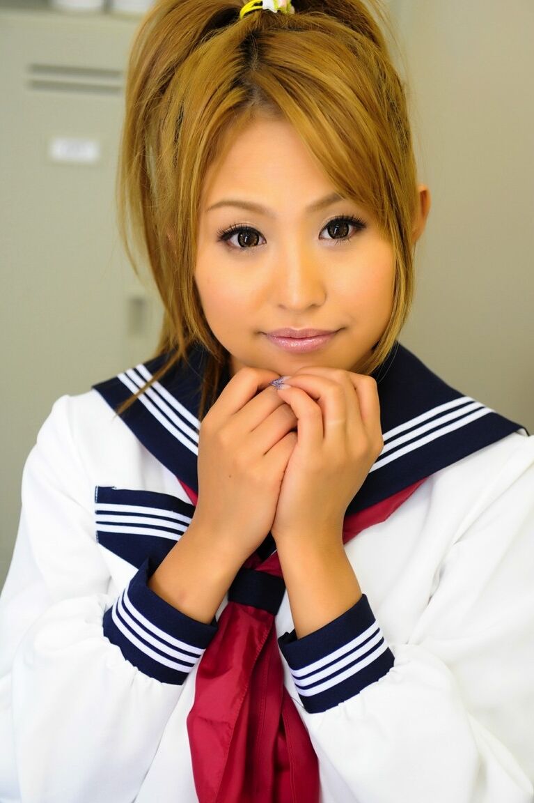 12P Adorable Japanese student with a pretty face poses on a bench in her uniform