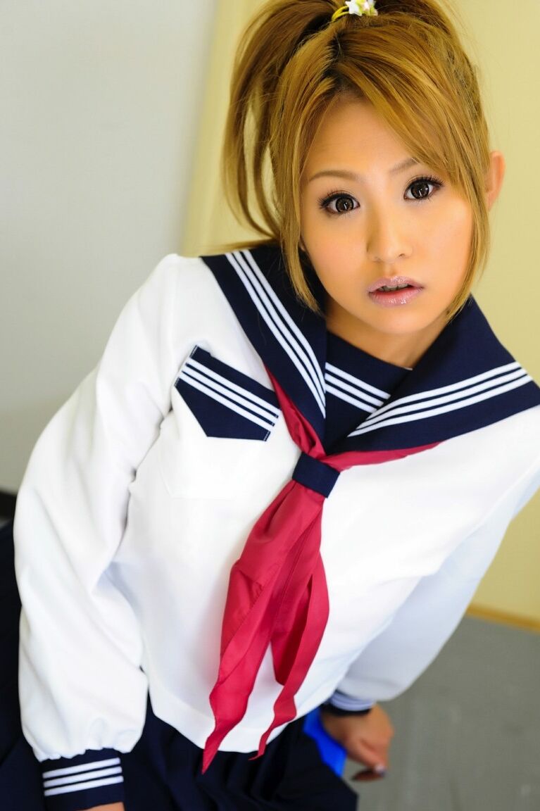 12P Adorable Japanese student with a pretty face poses on a bench in her uniform
