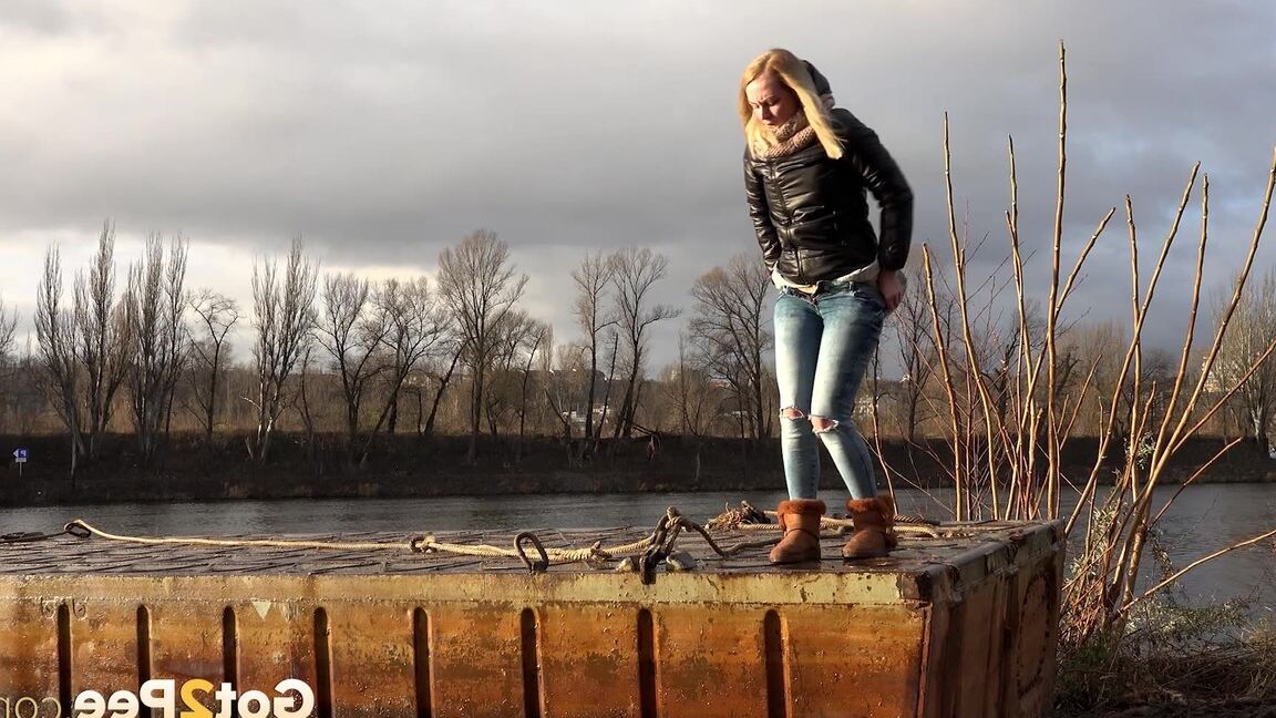 15P Pretty blonde squatting to pee by the river