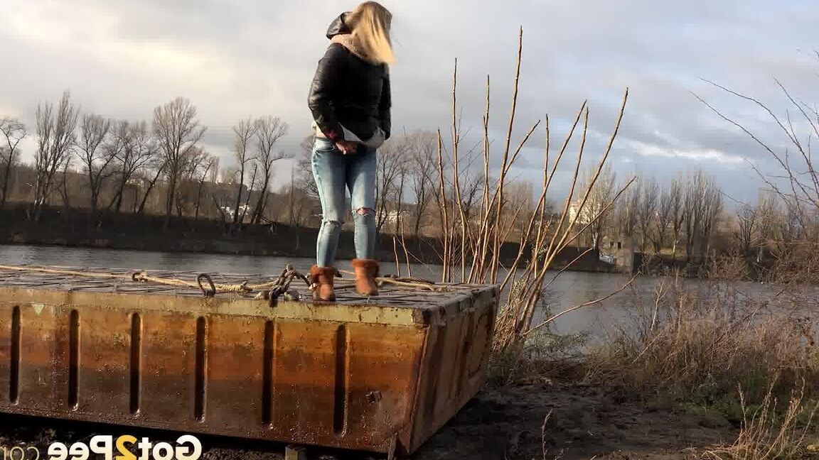 15P Pretty blonde squatting to pee by the river