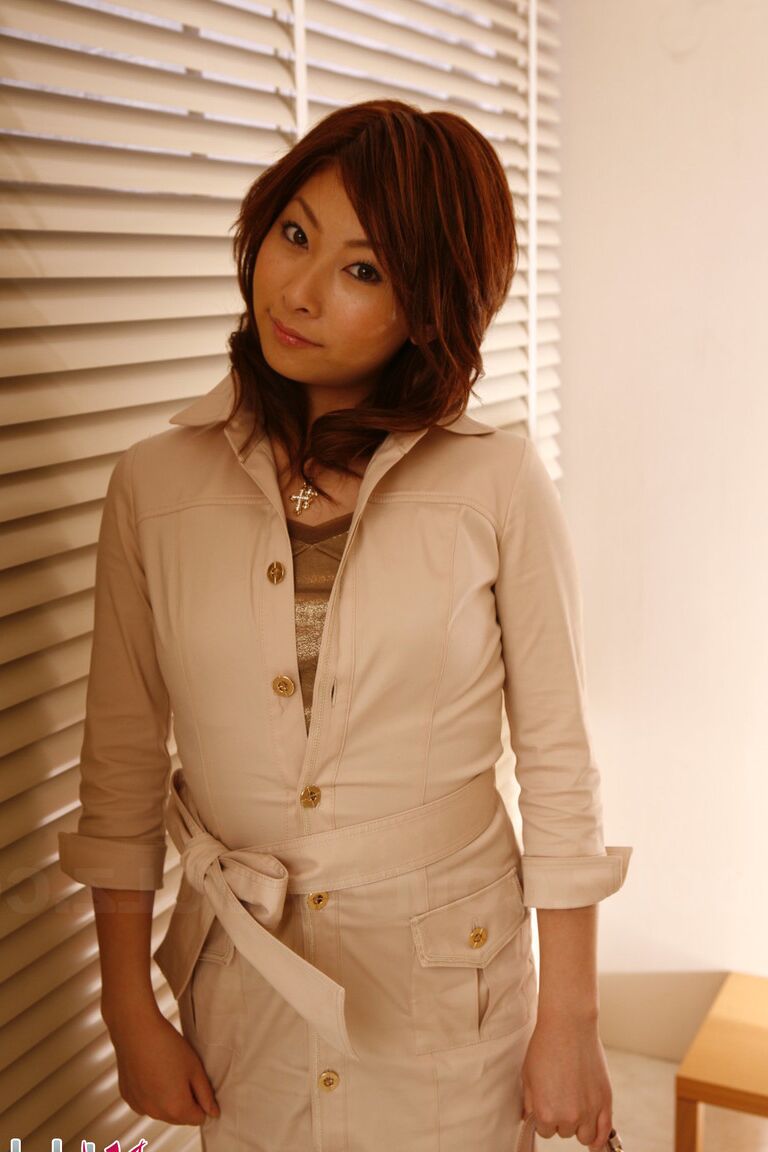 15P Japanese redhead Keiko Morikawa models fully clothed during a solo shoot