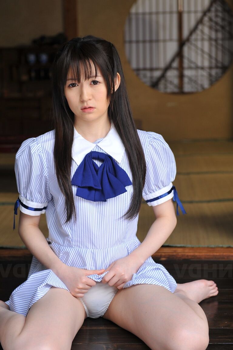 15P Japanese cutie Ai Uehara sits on the balcony and reveals her unshaved vagina