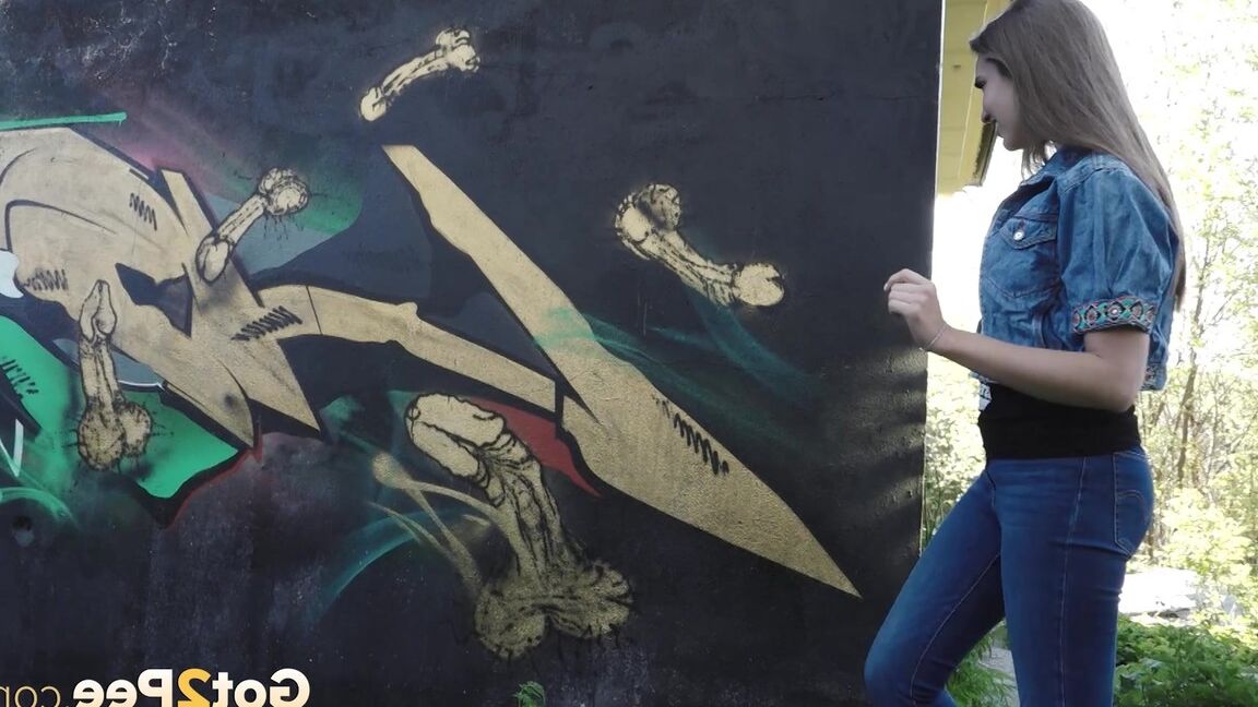 15P White girl Viktoria pulls down her jeans to take a pee near a wall of graffiti