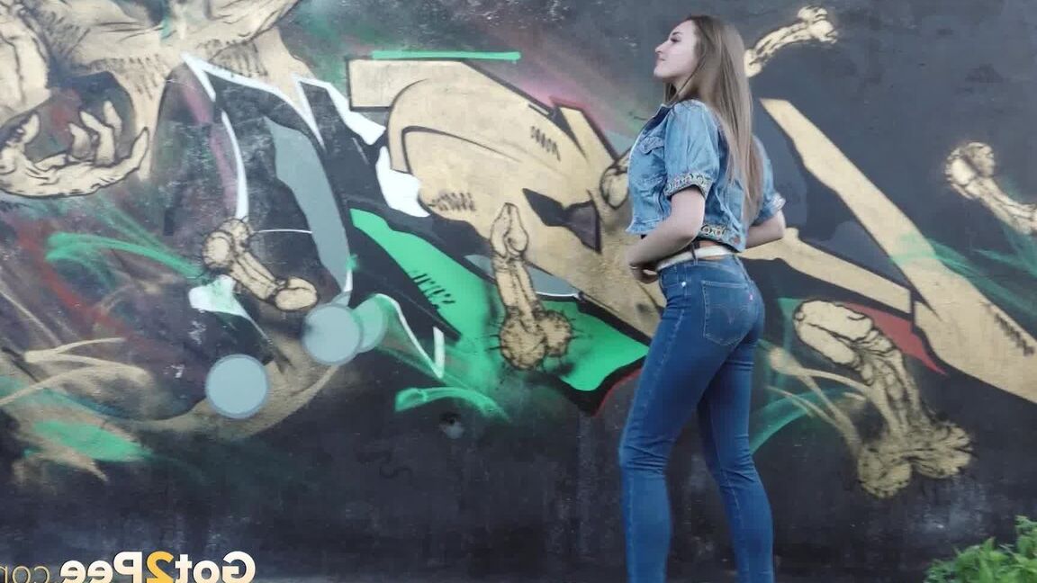 15P White girl Viktoria pulls down her jeans to take a pee near a wall of graffiti