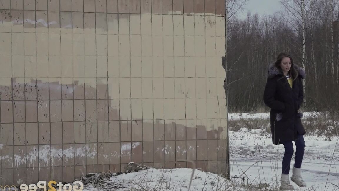 15P White girl Vika takes an urgent piss on snow-covered ground next to a building