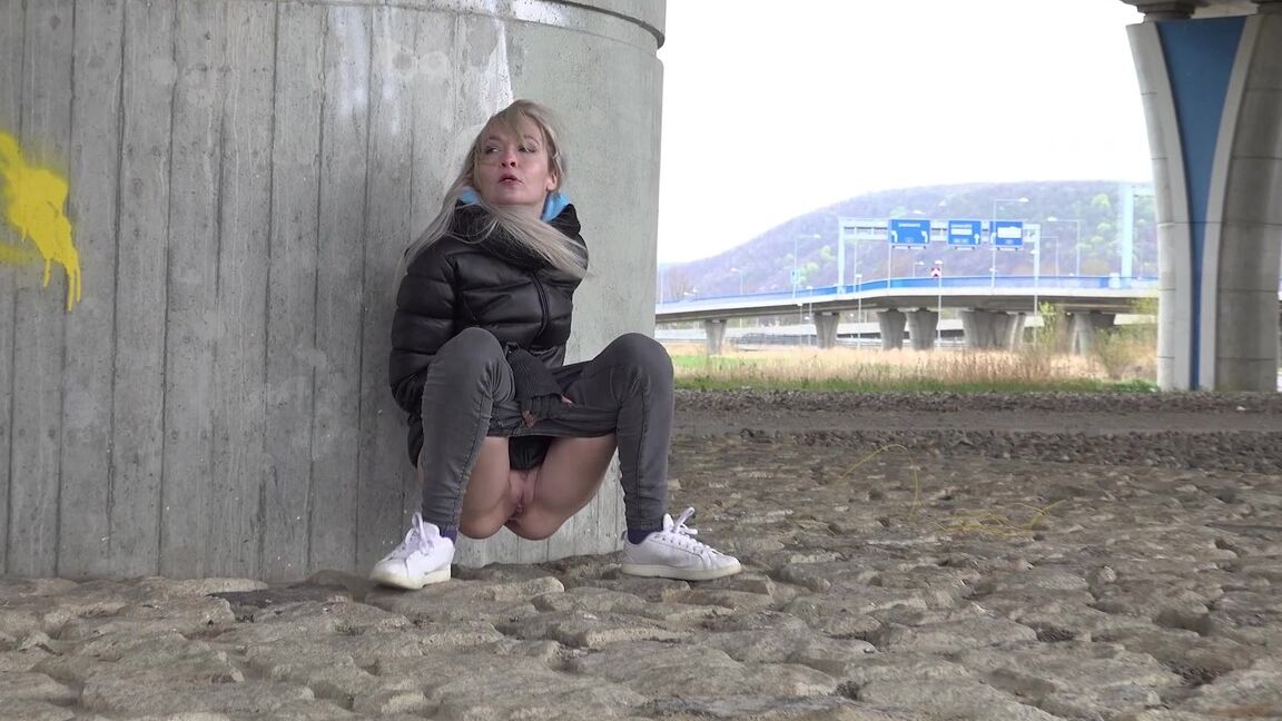 15P Short taken blonde squats for a piss underneath an overpass on a chilly day
