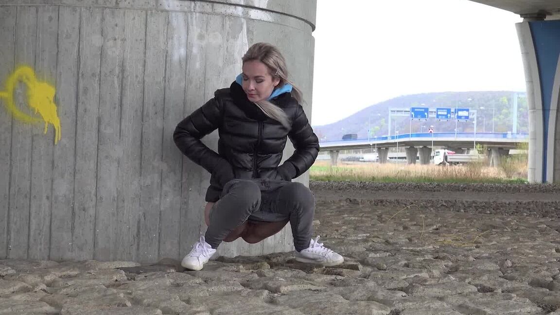 15P Short taken blonde squats for a piss underneath an overpass on a chilly day