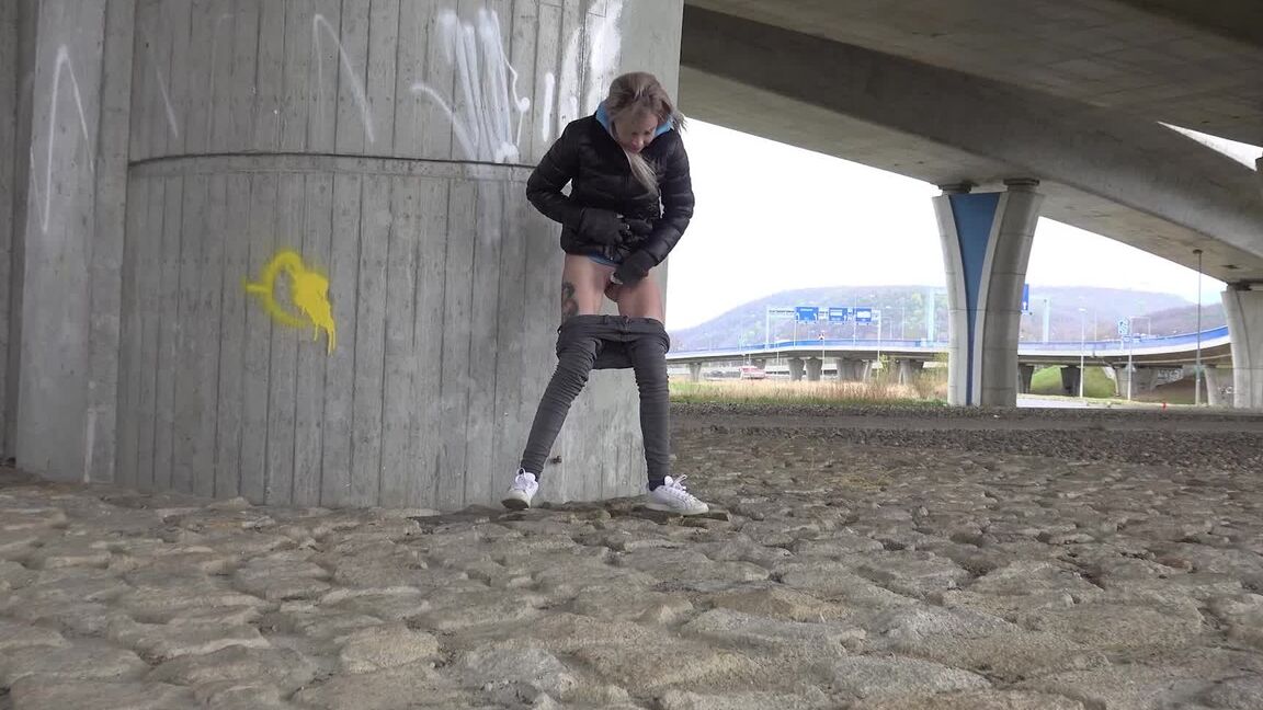 15P Short taken blonde squats for a piss underneath an overpass on a chilly day