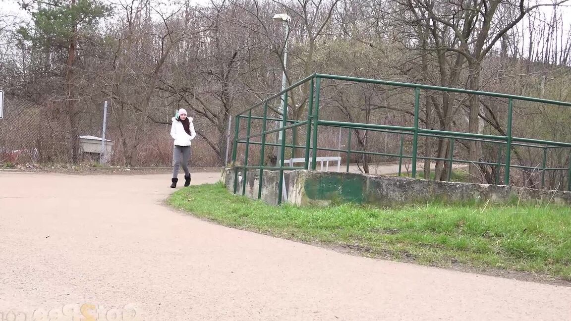 15P Clothed girl Mistica squats for a pee beside the road in winter clothing