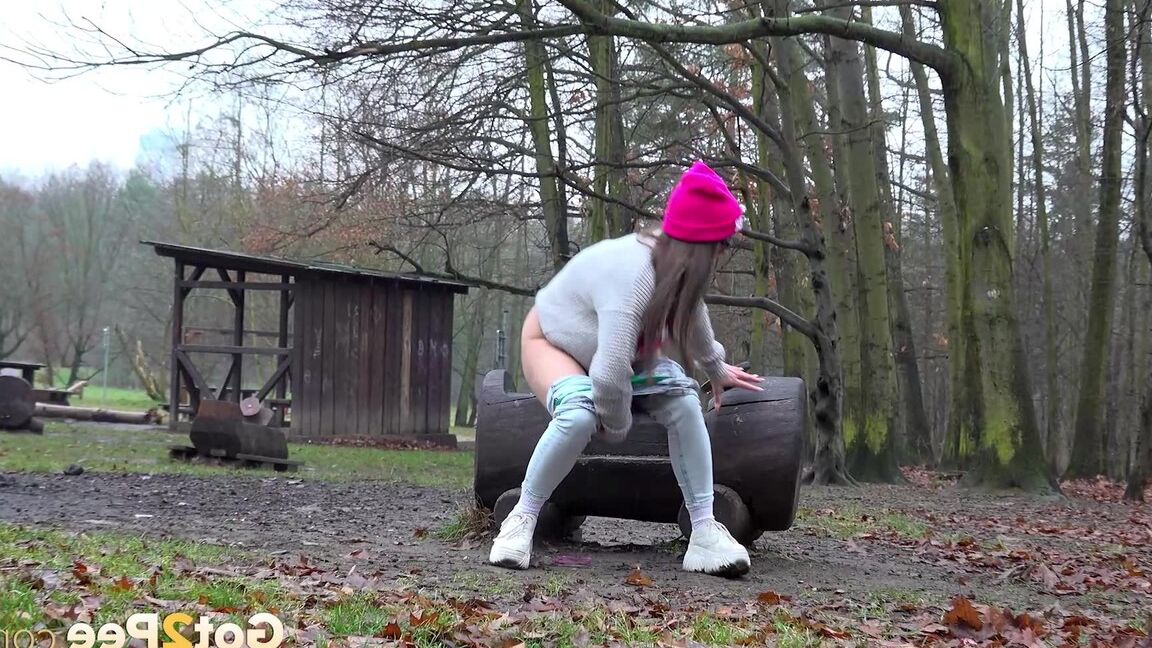 15P Caucasian chick takes a badly needed piss in a wooded location