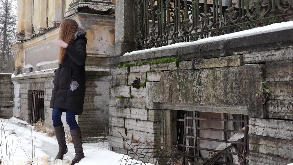 15P Clothed redhead Vika squats for a pee on the snow-covered steps of a church