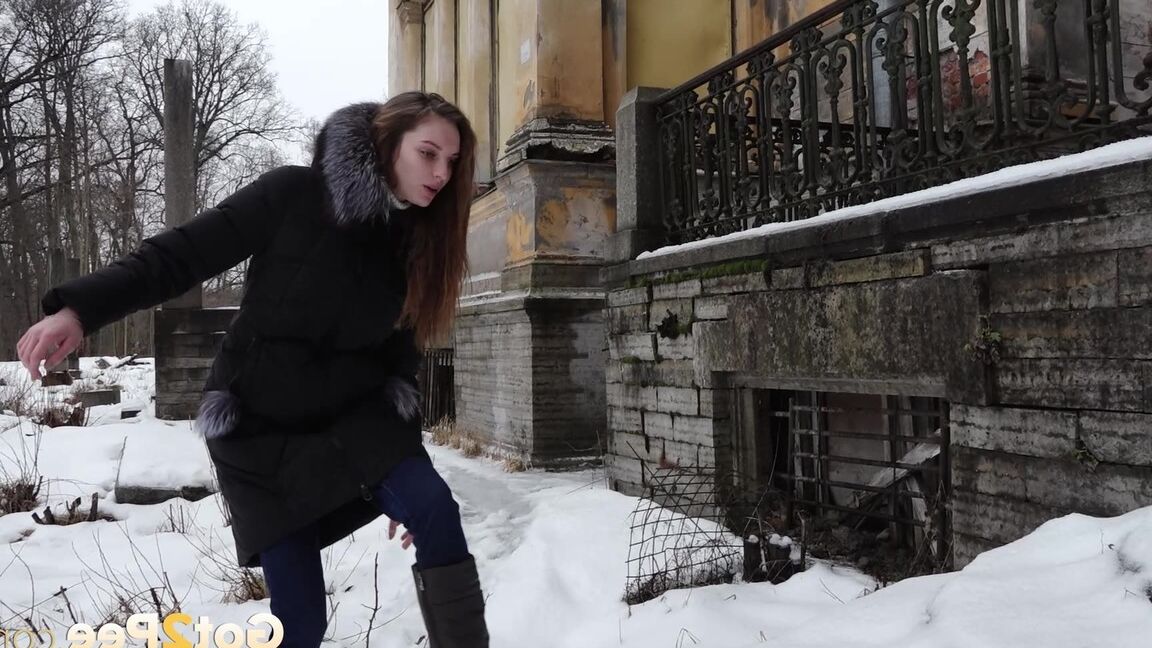 15P Clothed redhead Vika squats for a pee on the snow-covered steps of a church