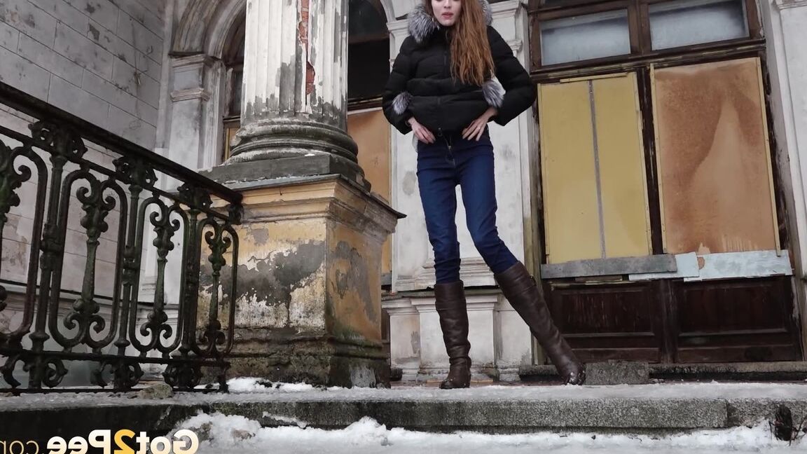 15P Clothed redhead Vika squats for a pee on the snow-covered steps of a church