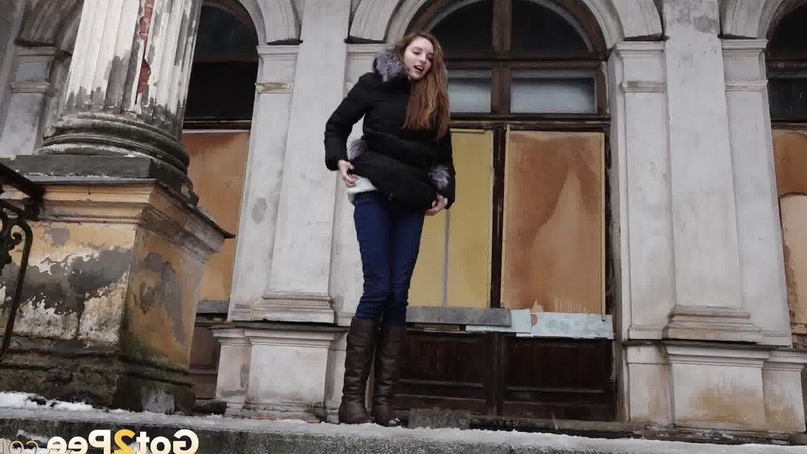 15P Clothed redhead Vika squats for a pee on the snow-covered steps of a church