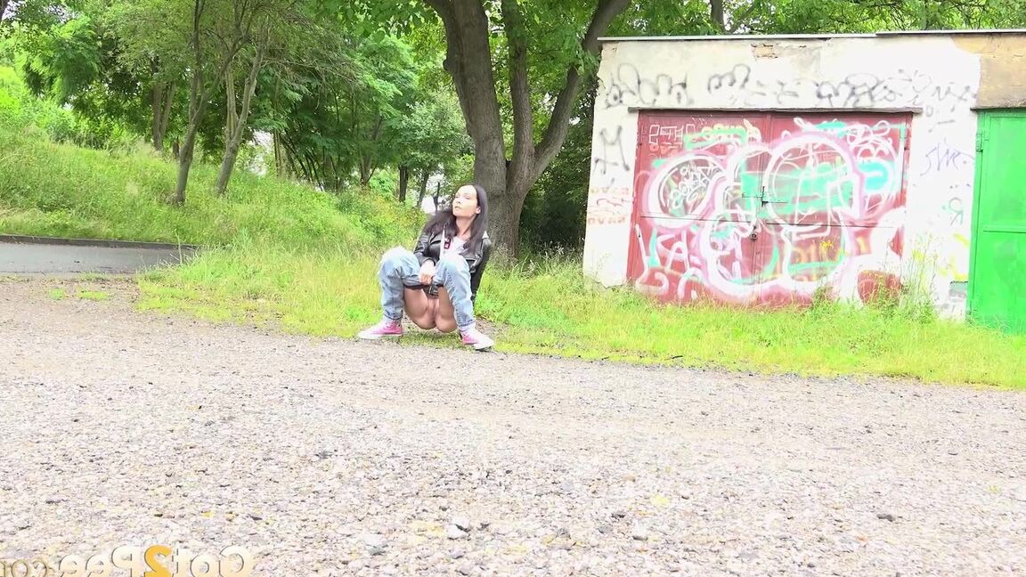 15P Solo girl with black hair squats for a piss on the side of a dirt road