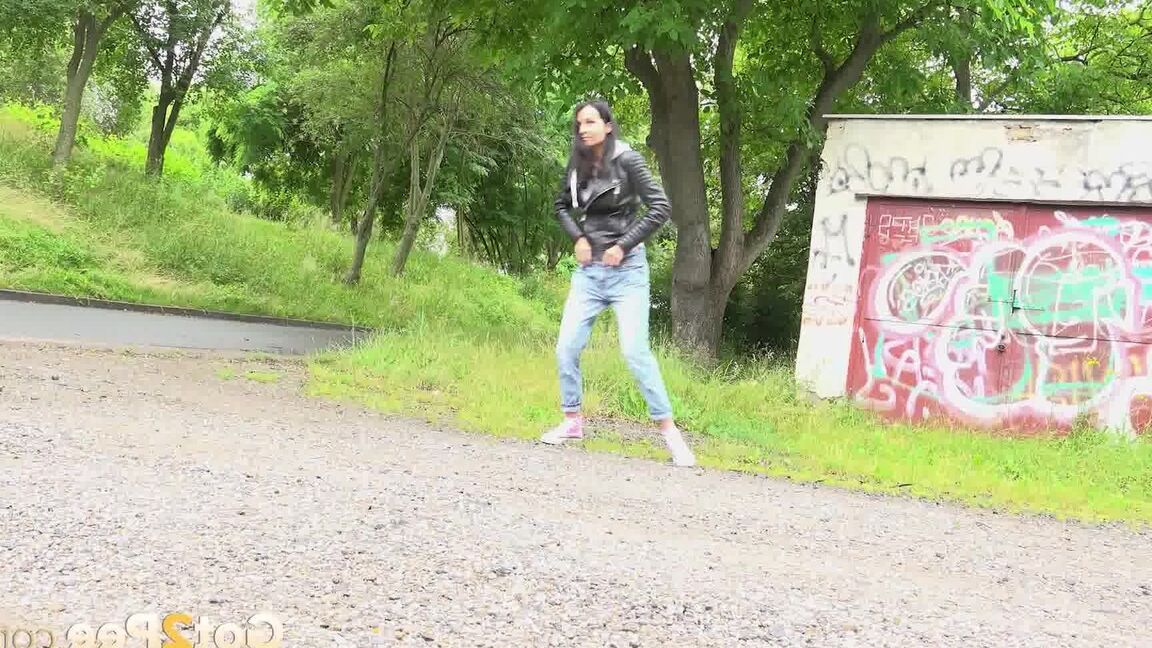 15P Solo girl with black hair squats for a piss on the side of a dirt road