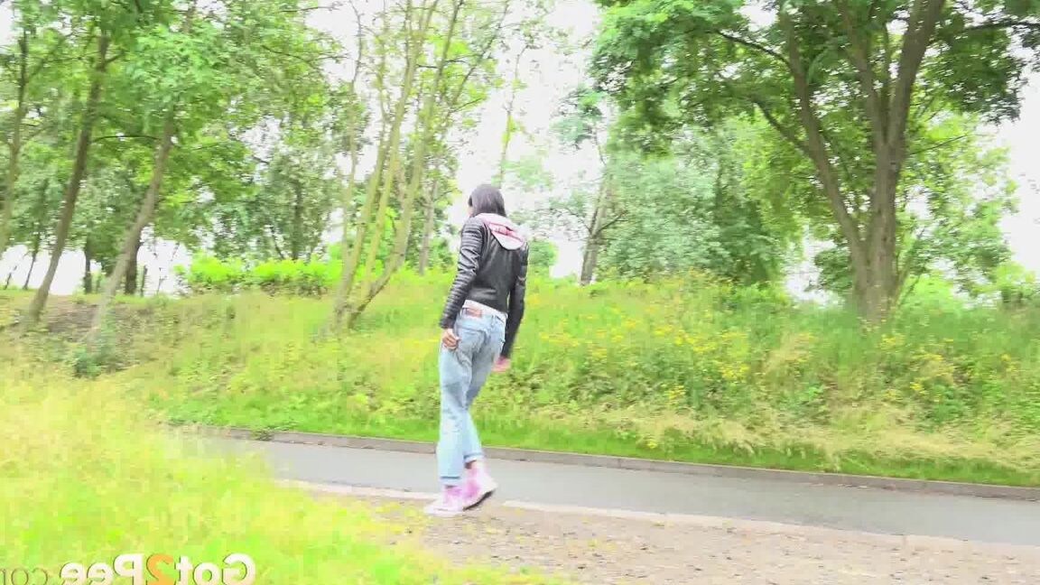 15P Solo girl with black hair squats for a piss on the side of a dirt road