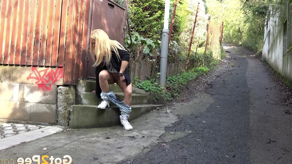 15P Blonde girl Jena Lovely pulls down ripped jeans for a pee in a laneway