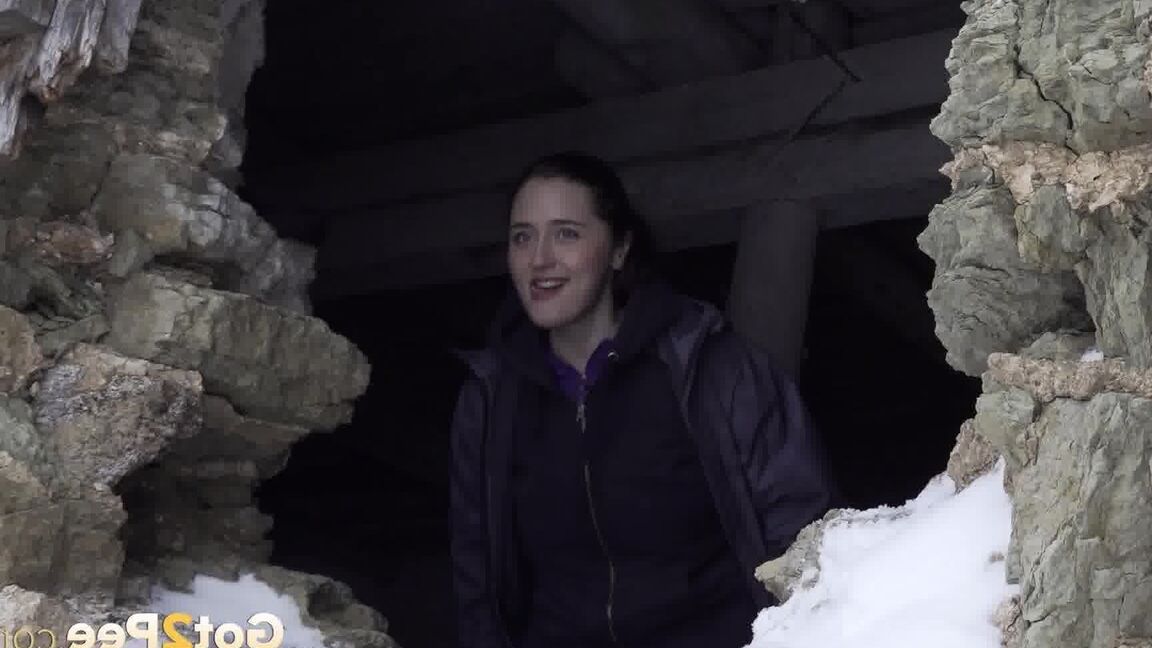 15P Hottie pees through a hole in a wall outside