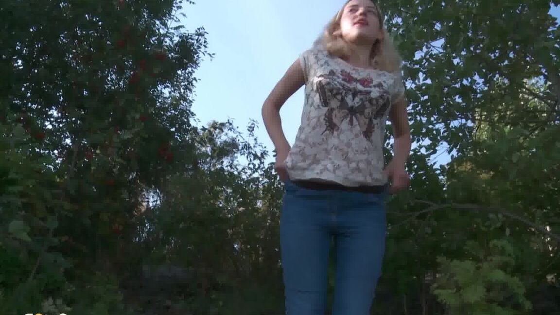 15P Blonde female Sasha is captured while taking a piss on a rocky bank