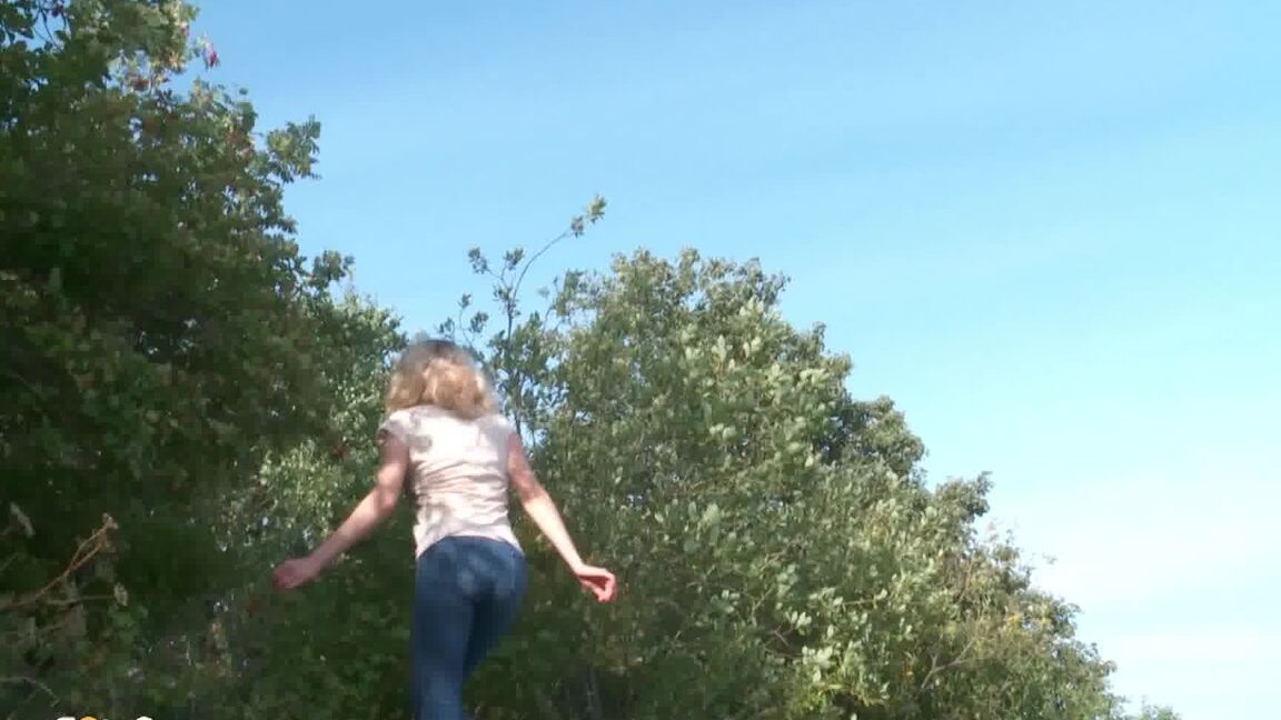 15P Blonde female Sasha is captured while taking a piss on a rocky bank