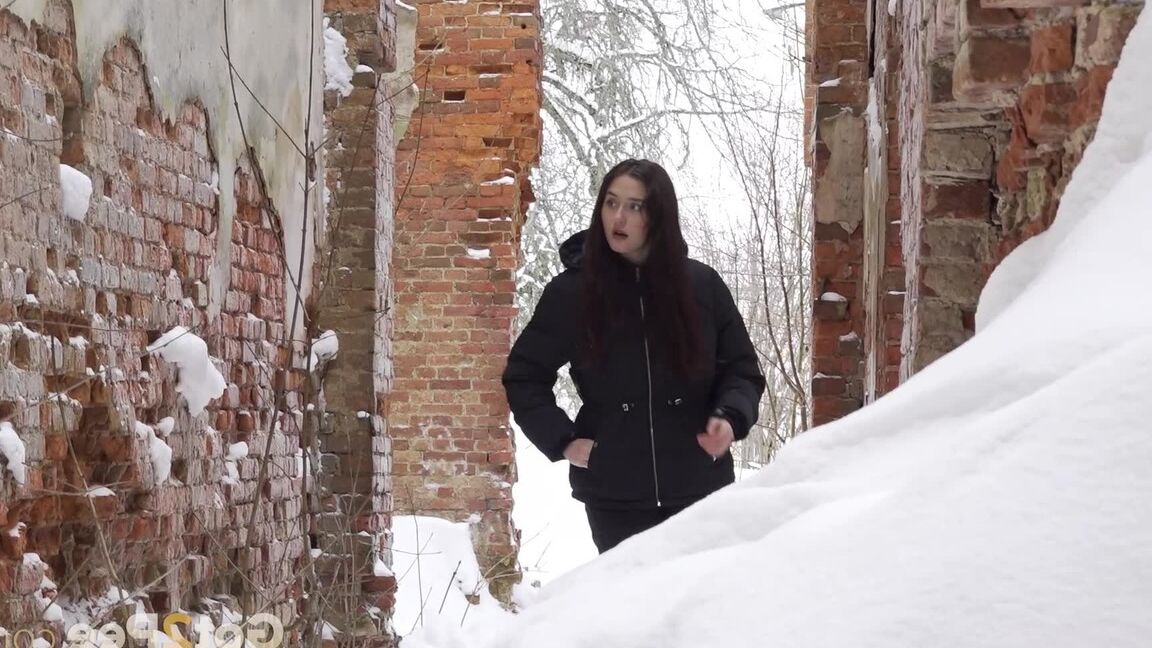 15P Gorgeous babe pees on a mound of snow