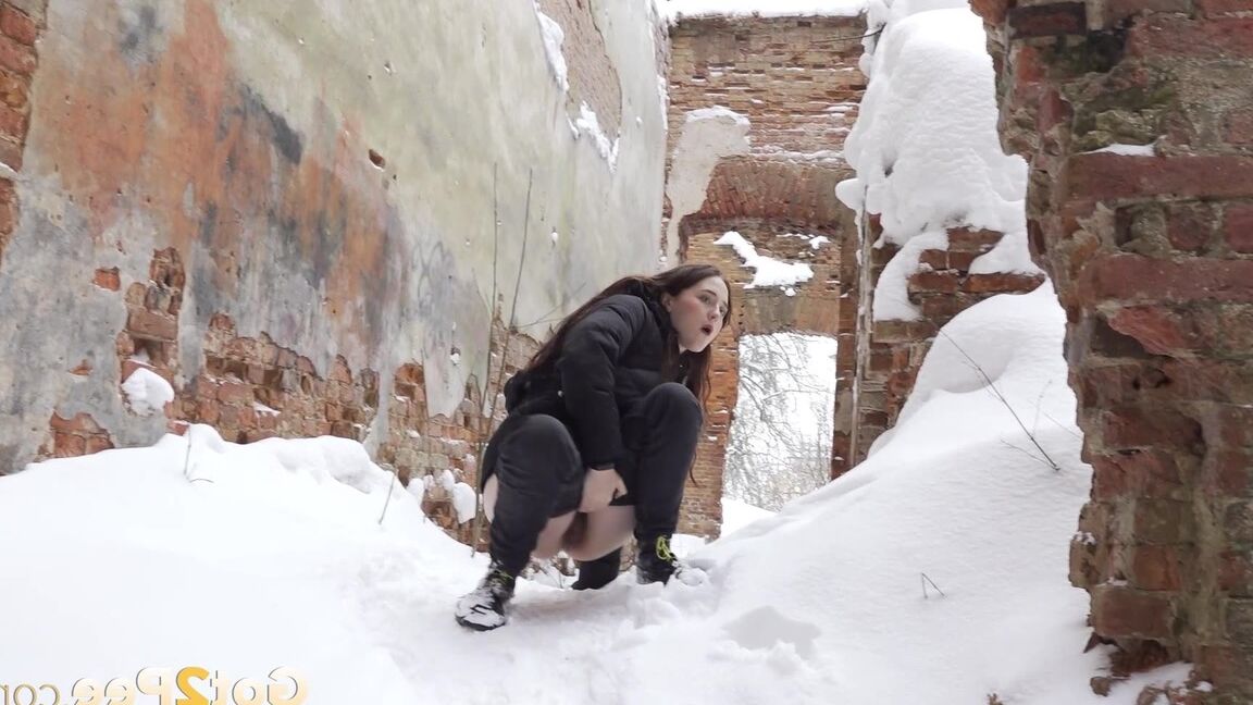 15P Gorgeous babe pees on a mound of snow