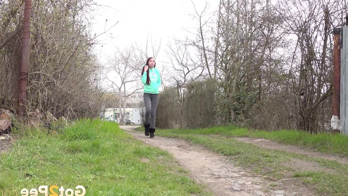 15P Short taken girl Mistika squats for an urgent piss on a dirt path