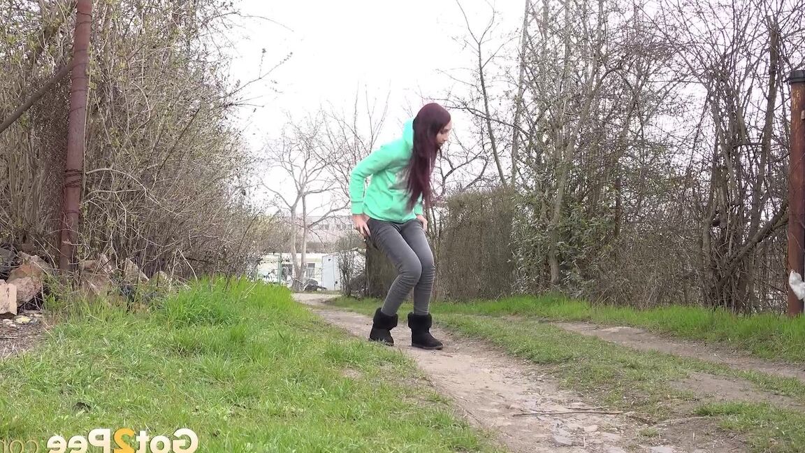 15P Short taken girl Mistika squats for an urgent piss on a dirt path