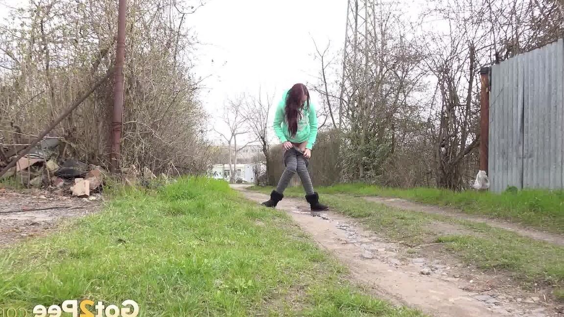 15P Short taken girl Mistika squats for an urgent piss on a dirt path