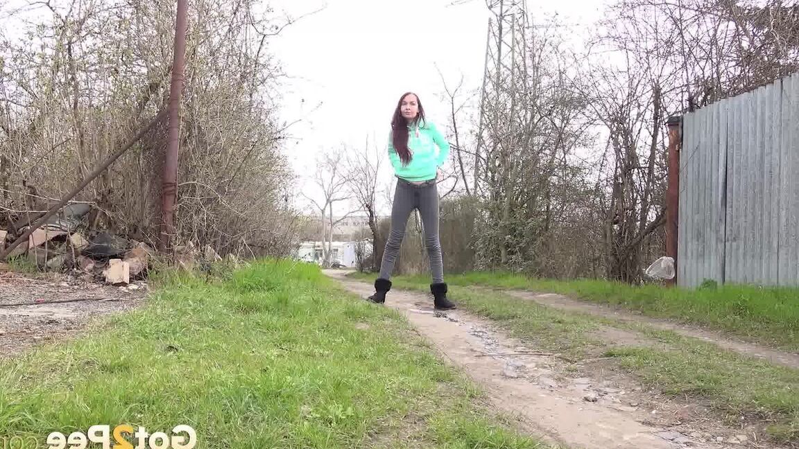 15P Short taken girl Mistika squats for an urgent piss on a dirt path