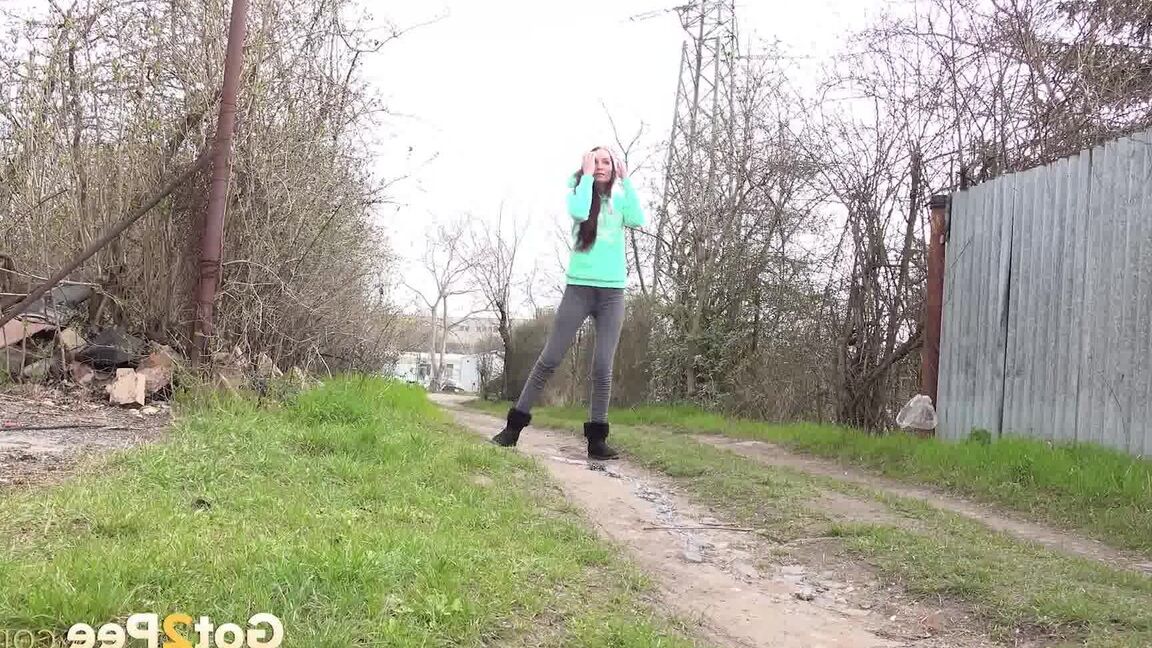 15P Short taken girl Mistika squats for an urgent piss on a dirt path