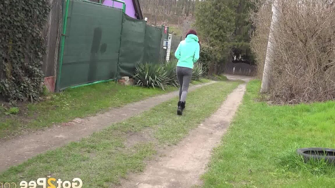 15P Short taken girl Mistika squats for an urgent piss on a dirt path