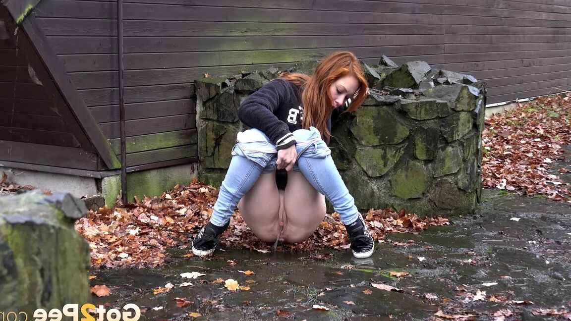 15P Cute redhead Sandra on a country walk pausing to squat for a hot outdoor pee