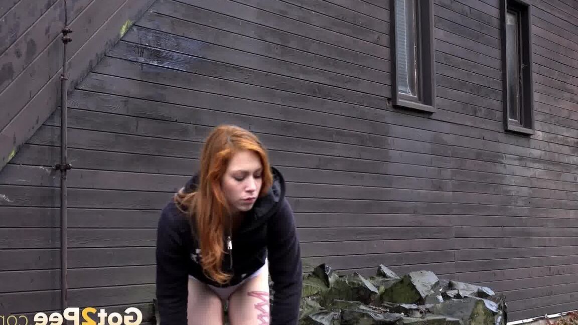 15P Cute redhead Sandra on a country walk pausing to squat for a hot outdoor pee