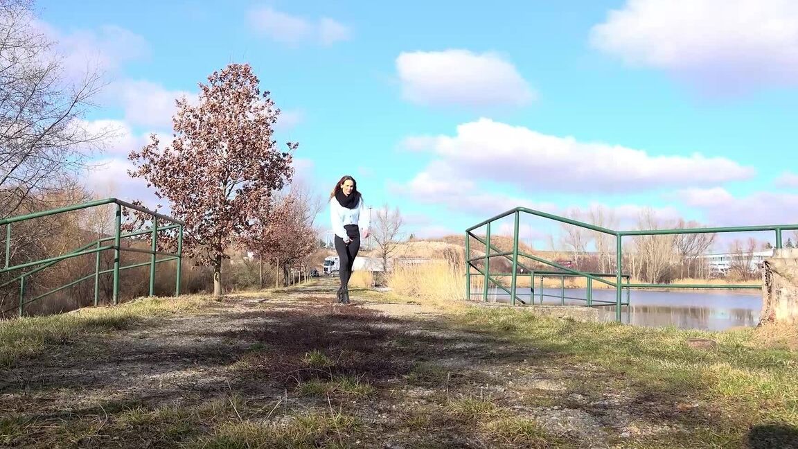 15P Cynthia Vellons squats on a tree stump to piss