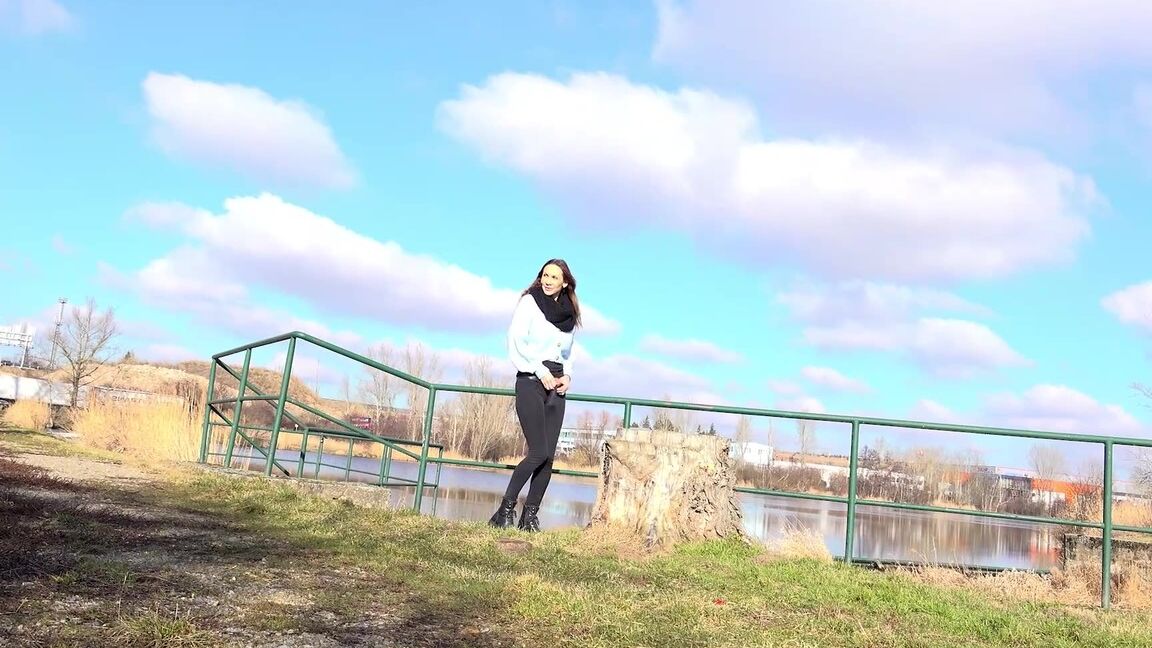 15P Cynthia Vellons squats on a tree stump to piss
