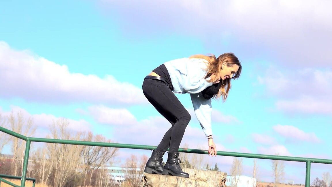 15P Cynthia Vellons squats on a tree stump to piss