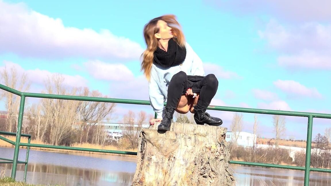 15P Cynthia Vellons squats on a tree stump to piss