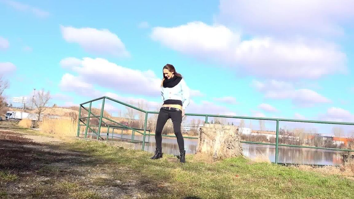 15P Cynthia Vellons squats on a tree stump to piss