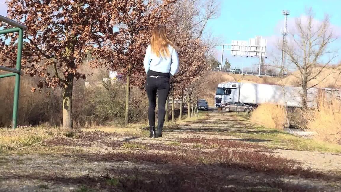 15P Cynthia Vellons squats on a tree stump to piss