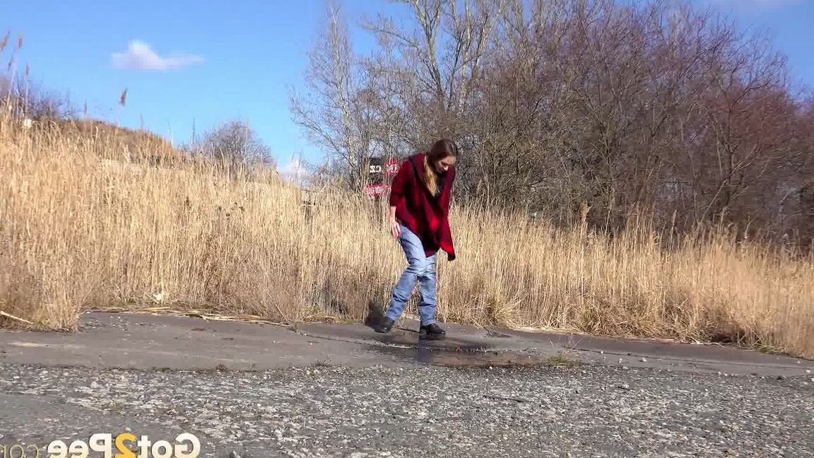 15P Cynthia Vellons squats and sprays an arc of piss