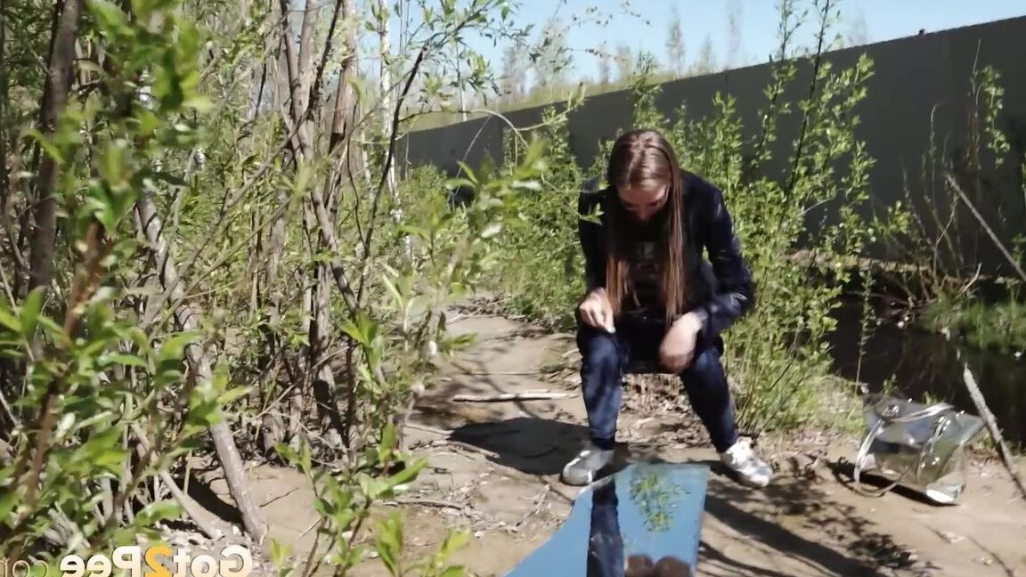 15P Distressed female Viktoria takes a badly needed piss on a mirror amid bushes