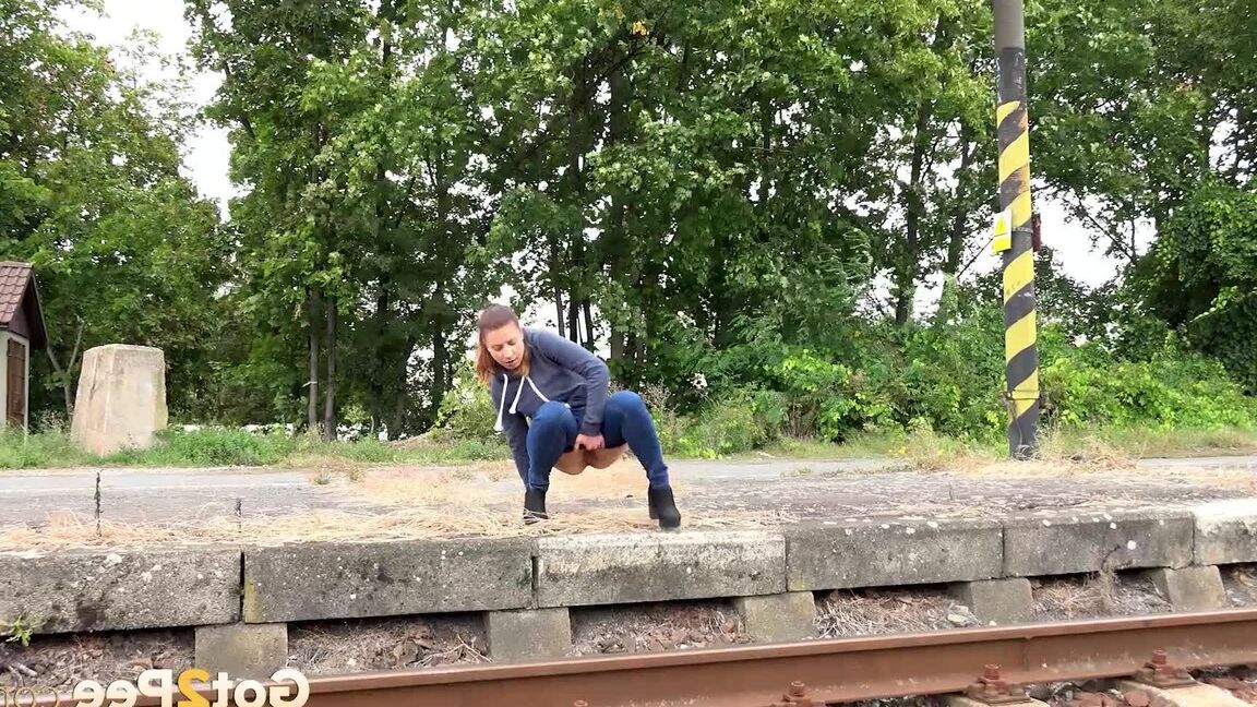 15P Naughty chick Teresa Bizarre pulls down her jeans and squats for a pee on curb