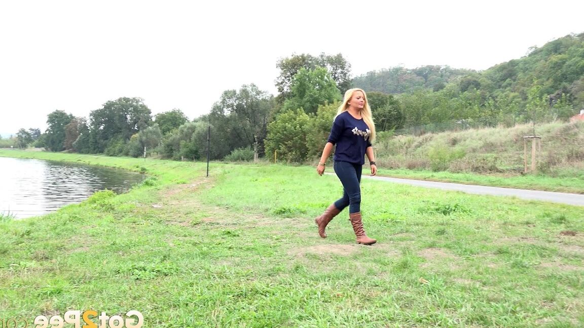 15P Thick blond chick Jenna Lovely squats for a piss next to bench beside the road