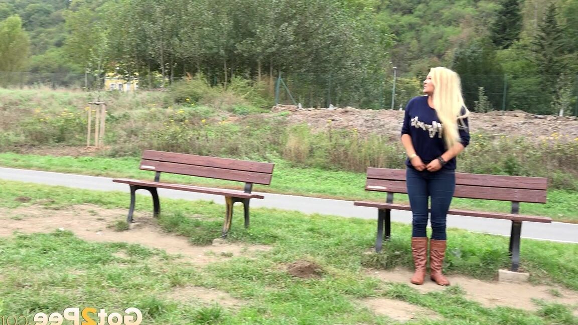 15P Thick blond chick Jenna Lovely squats for a piss next to bench beside the road